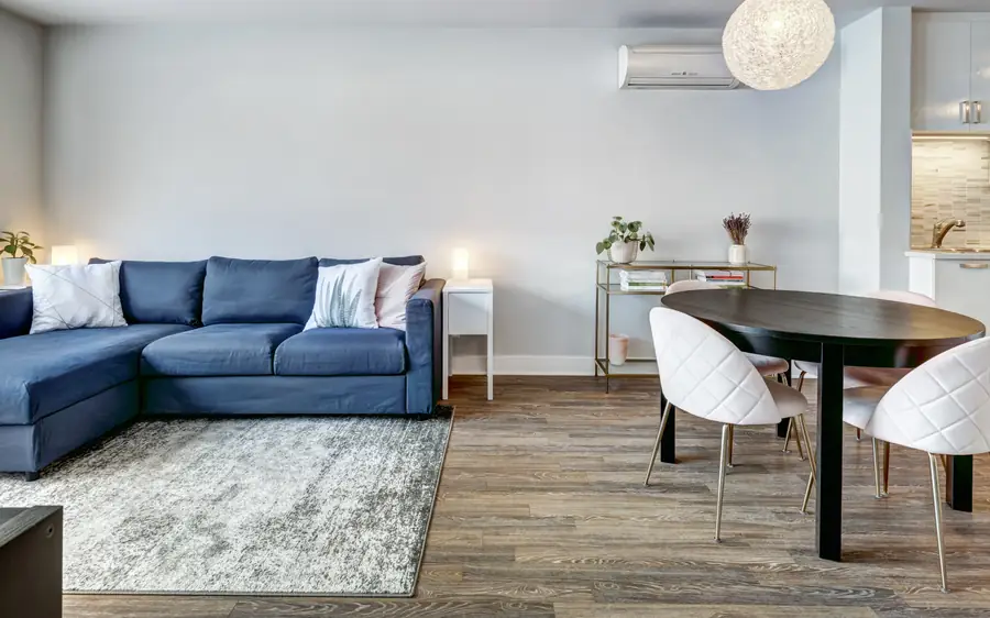 A furnished open plan living and dining room ready for guests