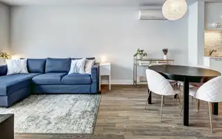 A furnished open plan living and dining room ready for guests
